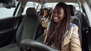 parent driving kids in car llJxxvv.width .jpg
