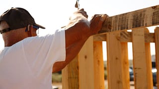 person building fence PbzLOJ.width .jpg