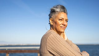 senior citizen relaxing at pier.jpg