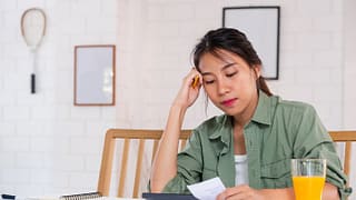 stressed woman with bills.width .jpg