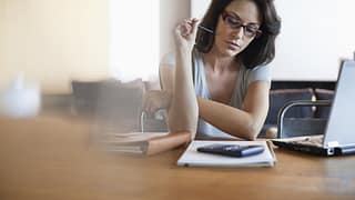 woman finance calculator laptop notebook Uo.width .jpg