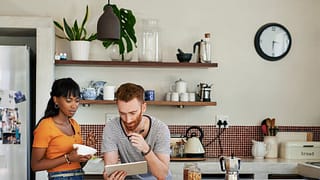 young couple in kitchen on tablet duUFRV.width .jpg