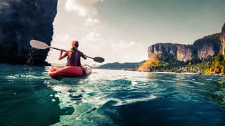 woman in kayak on ocean PZUXh.width .jpg