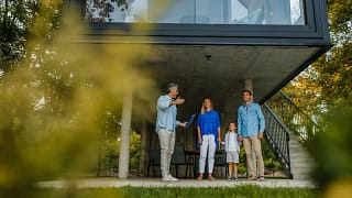 Family talking to realtor by extra modern hom.width jTPPh.jpg