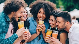Group of friends drinking juice outdoors. xRC.width .jpg