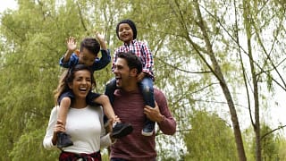 Happy family young kids outdoors.width .jpg