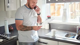 Homeowner on phone with mortgage company pFR.width .jpg