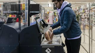 Shopper using self checkout BbREs.width .jpg