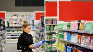 Woman carrying basket while shopping in a big.width FeXQF.jpg