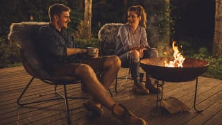 Young couple relaxing by a campfire PXmvo.width .jpg