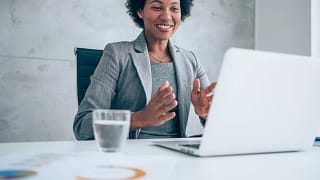 a person at a desk smiling.jpg