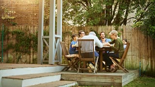 family eating on back deck.width .jpg