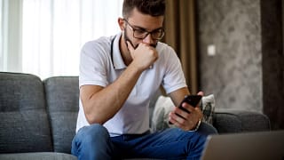 man s serious phone gettyimages .jpg