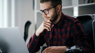 man s at desk serious gettyimages .jpg