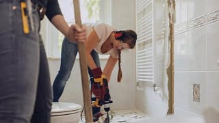 man and woman renovating bathroom rYWvGL.width .jpg