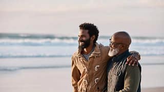 man with father on beach FEHtyJ.width .jpg