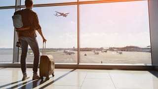 man with suitcase in airport.width .jpg