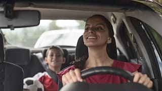 mom driving kid gettyimages .jpg