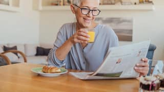 older woman newspaper gettyimages .jpg