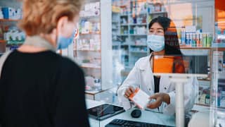 person receiving medicine from pharmacist IaP.width .jpg