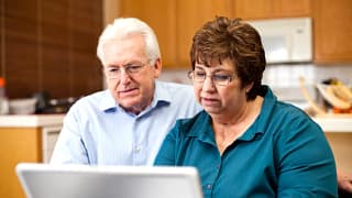 senior couple serious at laptop gettyimages .jpg