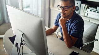 serious young man at computer.width .jpg