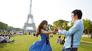 two people at eiffel tower ecTjov.width .jpg