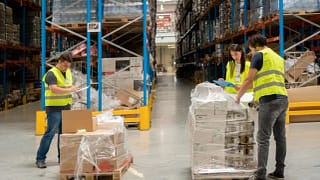 warehouse employees unpacking boxes.width .jpg
