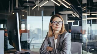 woman business suit desk gettyimages .jpg