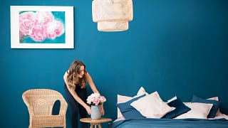 woman decorating bedroom.width .jpg
