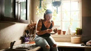 woman on kitchen counter in apartment zhAoe.width .jpg