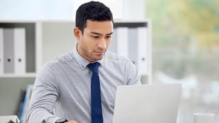 younger man at laptop serious gettyimages .jpg