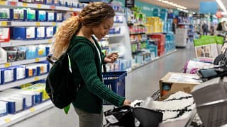 Consumer shopping with basket in a discount s.width .jpg