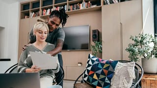 Couple having discussion while using laptop a.width oNPyjVl.jpg