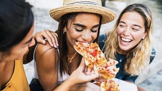 Group of friends enjoying pizza together. Ps.width .jpg