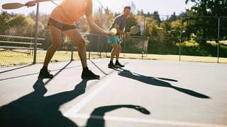 Pickleball players on a court. RTxCCV.width .jpg
