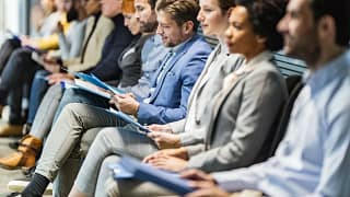 Row of people awaiting interviews VxyuZSa.width .jpg