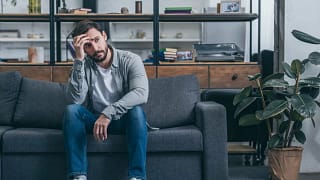 Upset man on couch gSMaXR.width .jpg