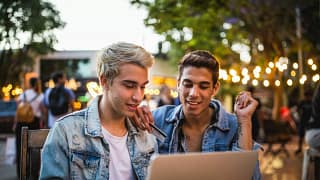 Young couple sit outdoors credit card MHYcYn.width .jpg