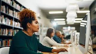 Young woman using laptop at the library slDaC.width .jpg