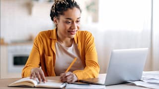 college student taking notes gettyimages .jpg