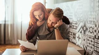 couple with bills and computer.width .jpg