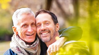getty happy smiling couple lgbt gay outdoors.jpg