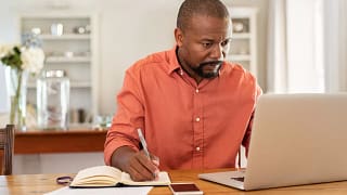 middle aged man at laptop gettyimages .jpg