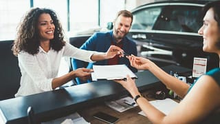 two people buying car from salesperson bfeJF.width .jpg