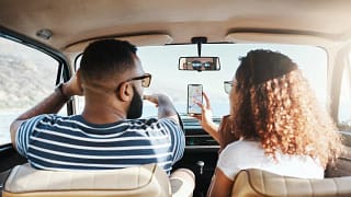 two people driving car HlRq.width .jpg