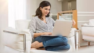 woman s laptop couch gettyimages .jpg
