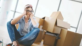 woman with moving boxes wNRmGR.width .jpg