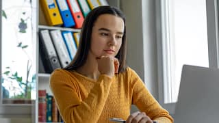 young woman looking at laptop.jpg