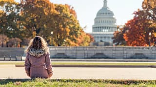 Woman sitting outside the capitol building on.width jUkdkxR.jpg